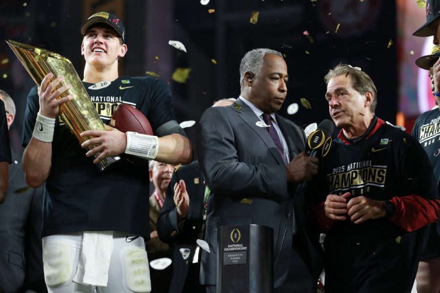 At University of Phoenix Stadium, Alabama quarterback Jake Coker (14) celebrates as ESPN's John Saunders interviews head coach Nick Saban after the Crimson Tide defeated Clemson for the 2016 CFP National Championship Monday night.  (Allen Kee/ESPN Images)