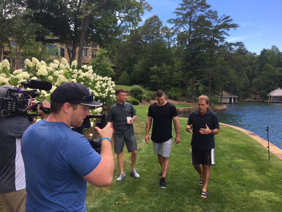 Alabama coach Nick Saban (right) walks and talks with ESPNâ€™s Marty Smith and Tim Tebow at Sabanâ€™s lake home in Georgia. (Jonathan Whyley/ESPN)