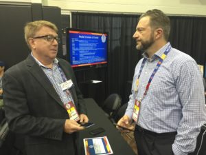 Grant (right) speaking with ESPN.com NHL writer Scott Burnside at the World Cup of Hockey. (Diane Lamb/ESPN)