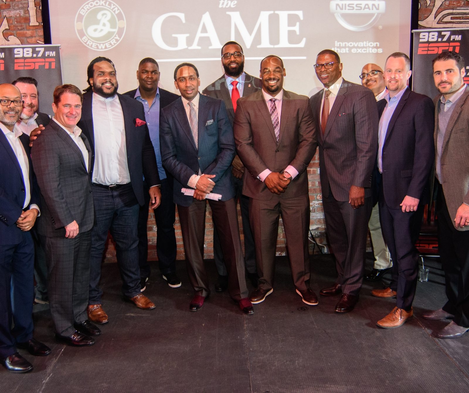 (L-R) Kevin Merida, Ryan Hurley, Tim McCarthy, Willie Colon, Keyshawn Johnson, Stephen A Smith, Chris Canty, Donovan McNabb, Carl Banks, Bill Stephney, Justin Craig, Rick DiPietro. (Jeff H. Skopin/ESPN)
